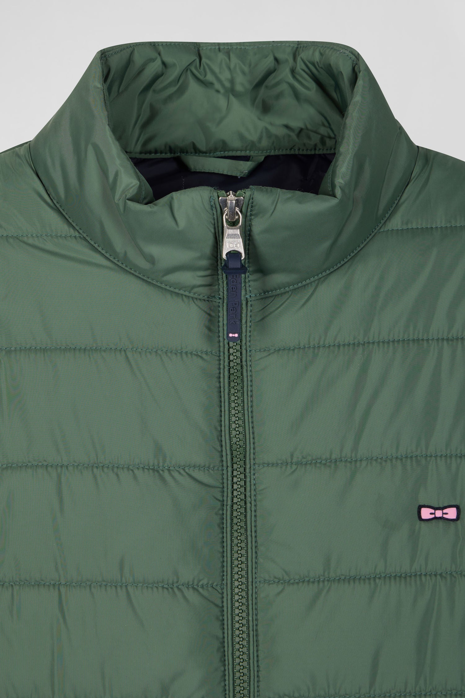 Green quilted sleeveless high collar down vest