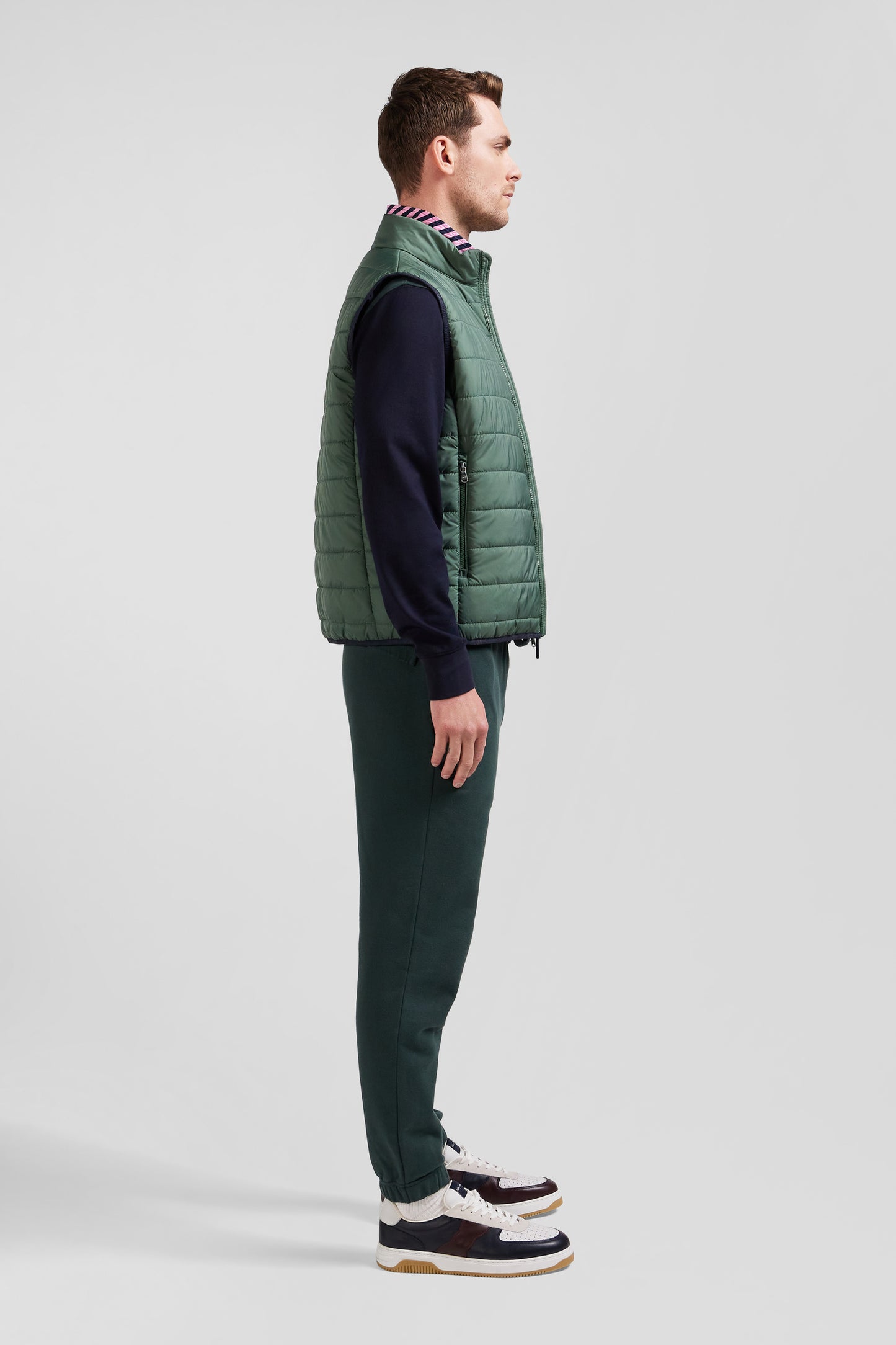 Green quilted sleeveless high collar down vest