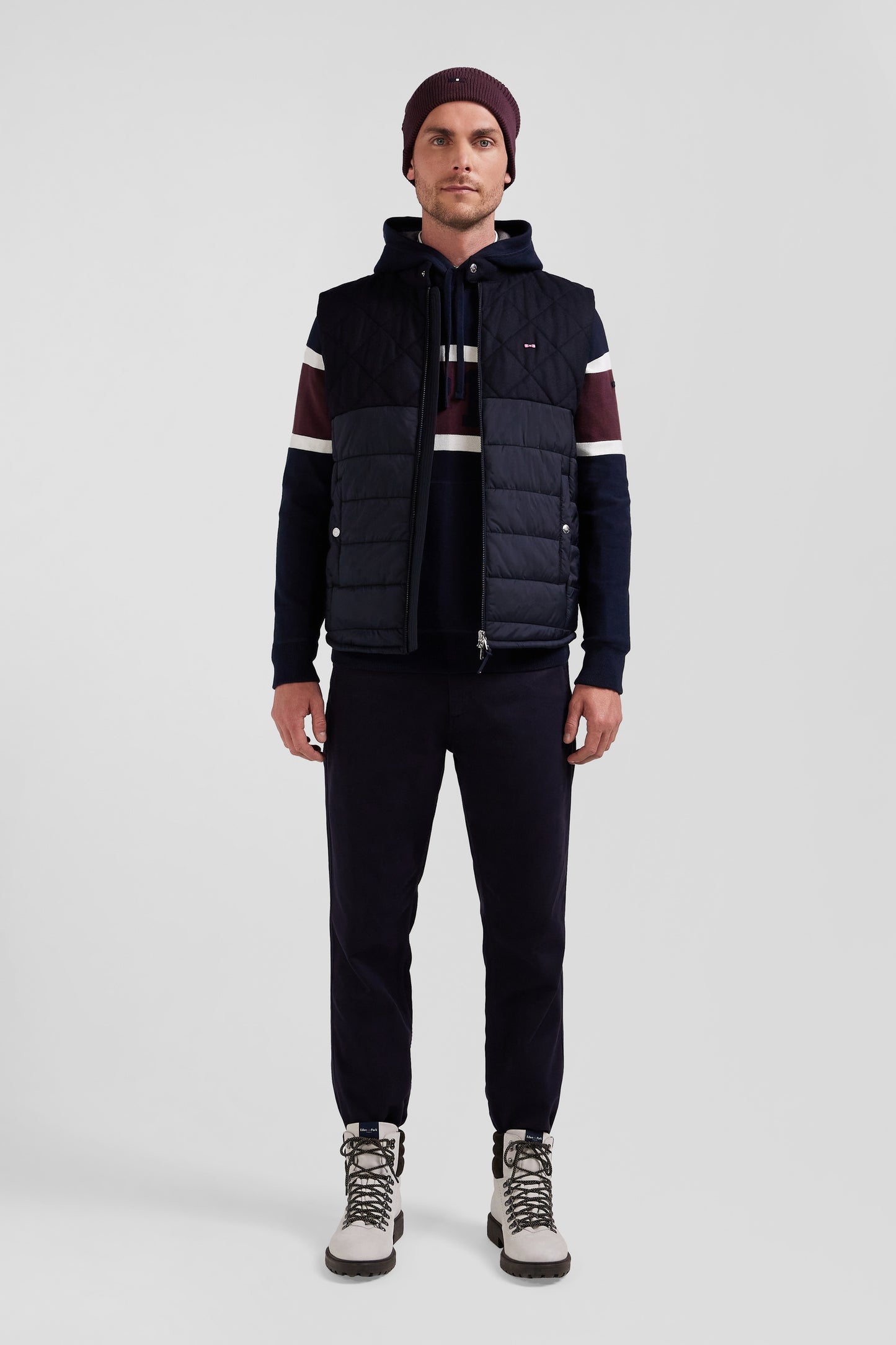 Navy blue sleeveless double quilted high collar down vest