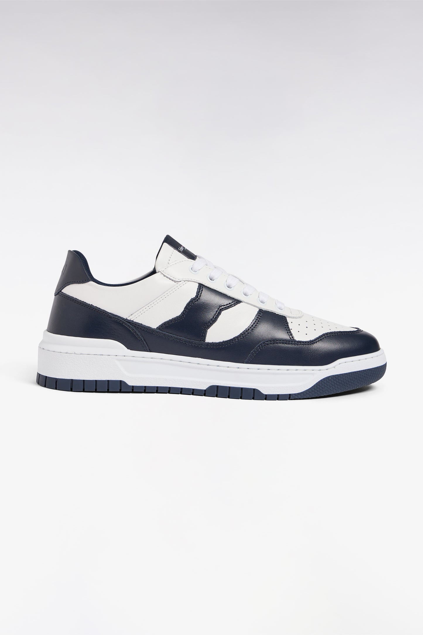 Two-tone navy and white leather sneakers