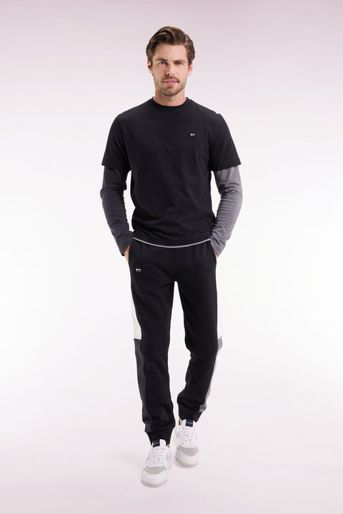 Jogging suit in black colorblock brushed fleece, straight cut - Image 1