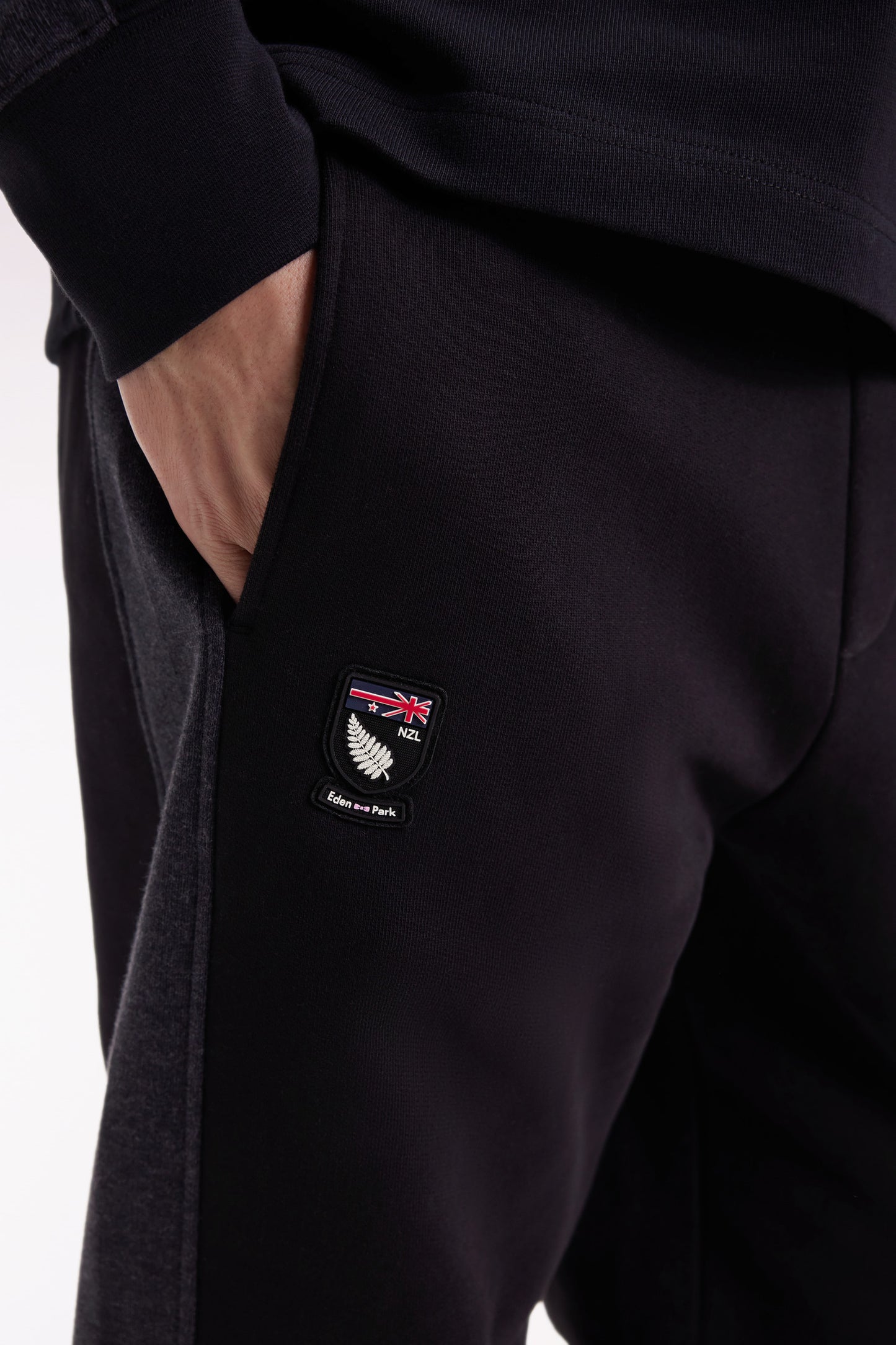 Black brushed fleece jogging suit with striped pockets Relaxed cut