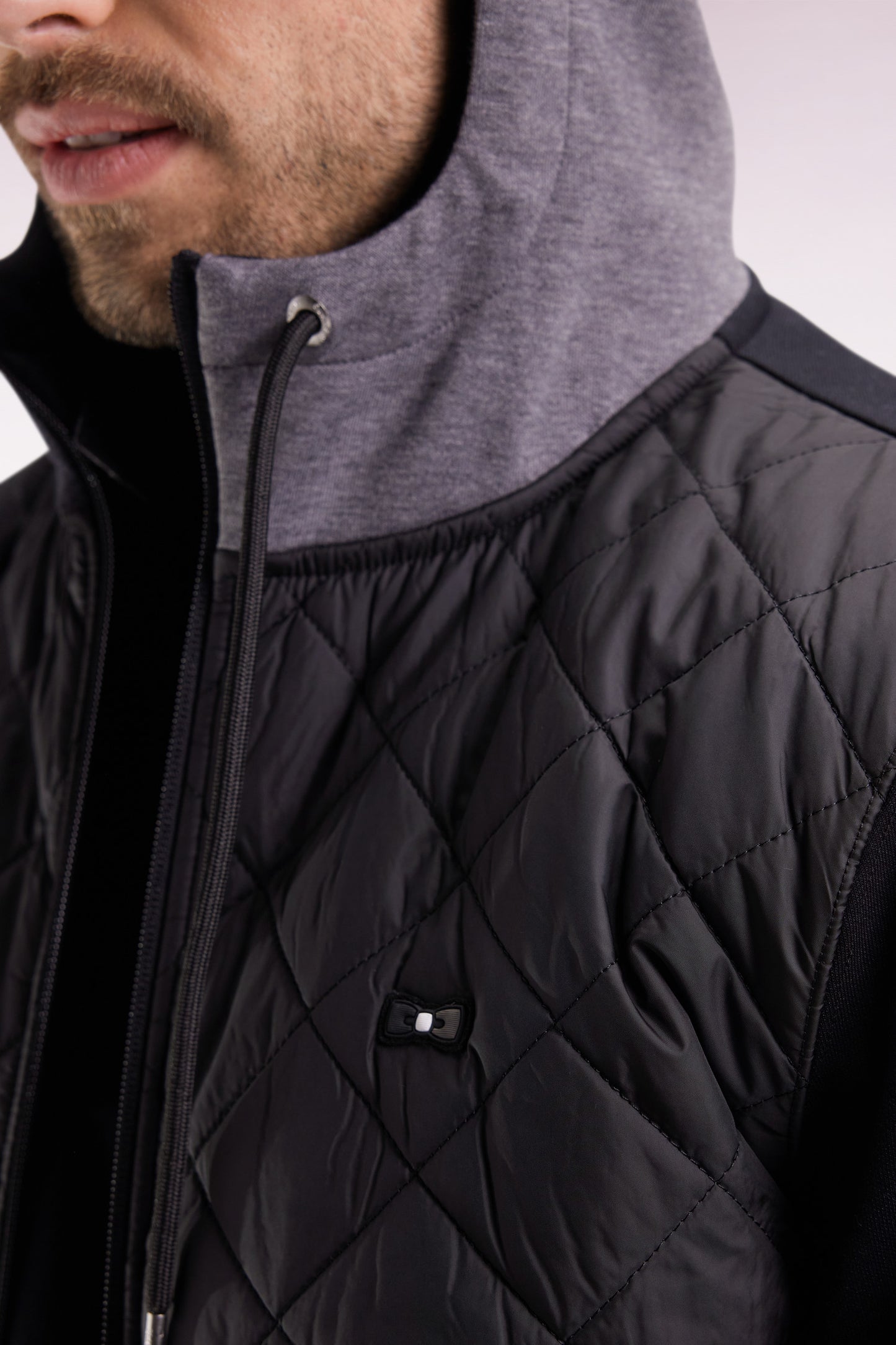 Zipped sweatshirt in black and grey quilted bimaterial interlock