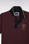 Short-sleeved polo shirt in burgundy cotton pique with straight cut patch