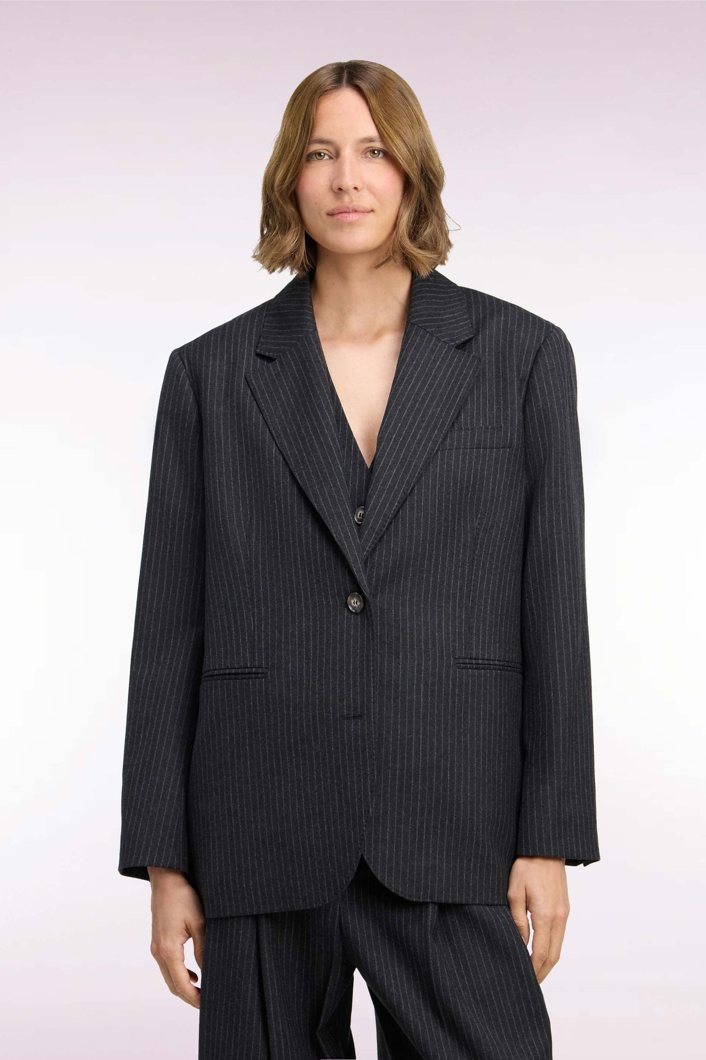 Veste blazer à manches rayées en laine stretch noir coupe oversized