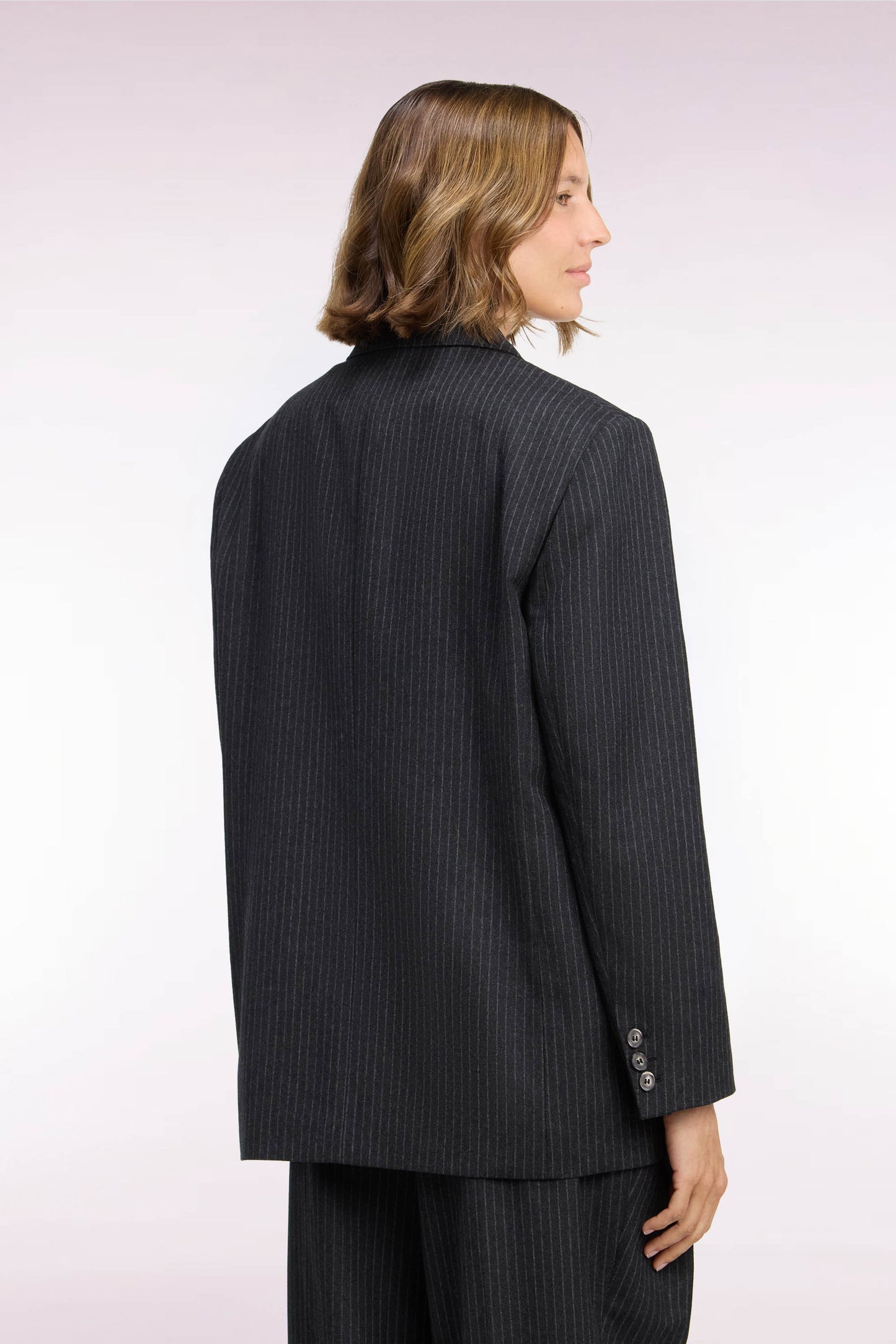 Veste blazer à manches rayées en laine stretch noir coupe oversized