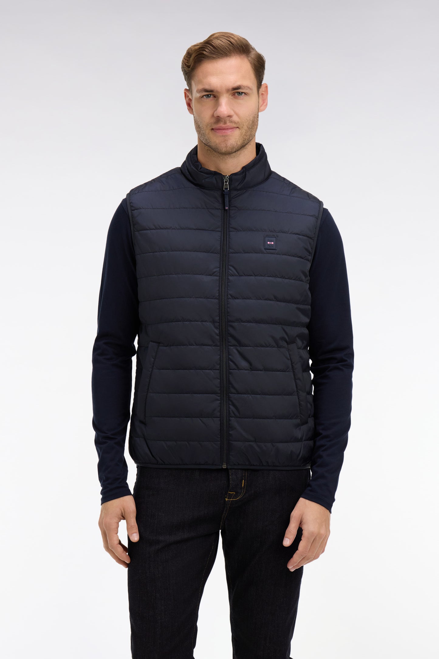 Navy blue sleeveless puffa jacket