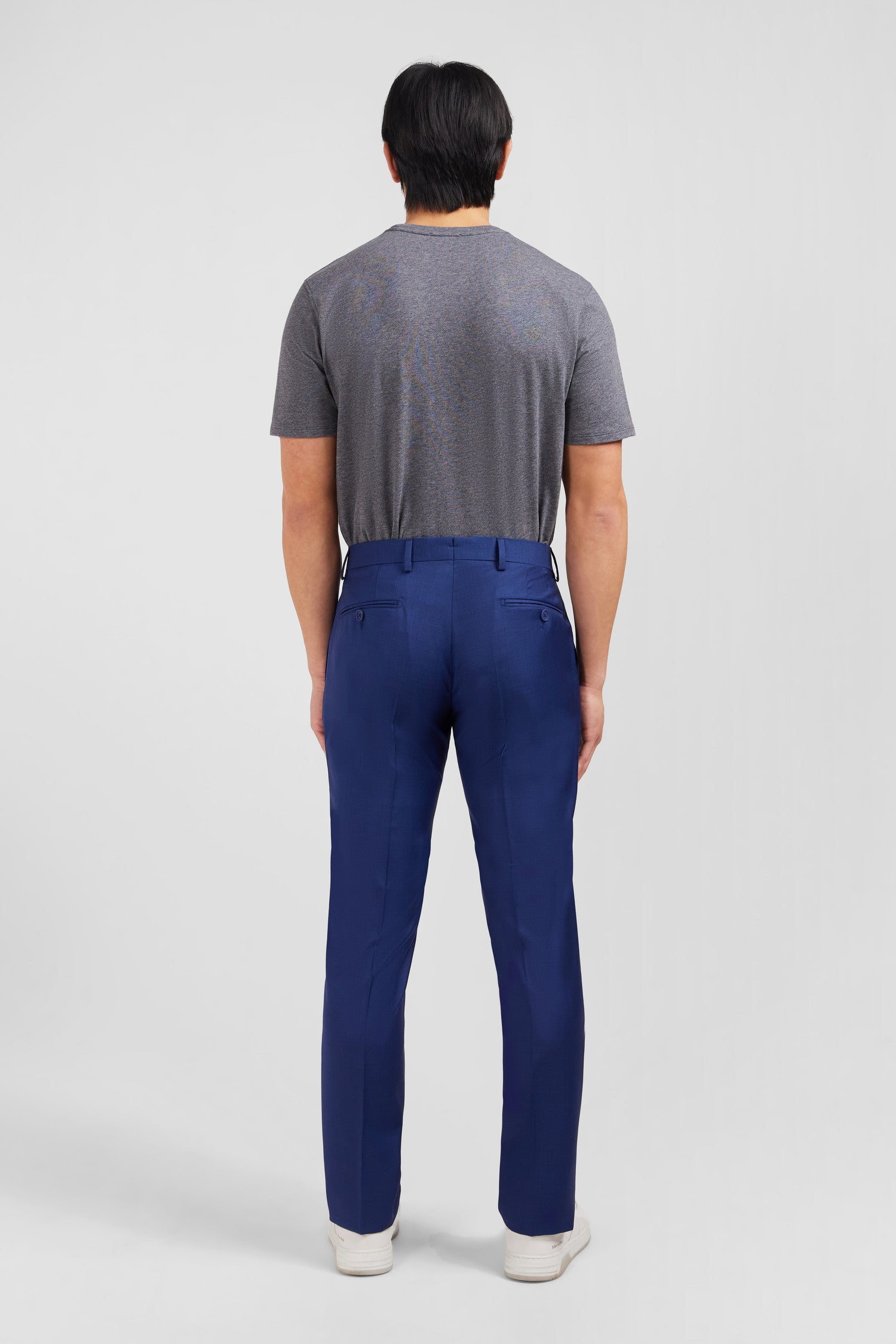 Slim blue wool trousers with broken fold