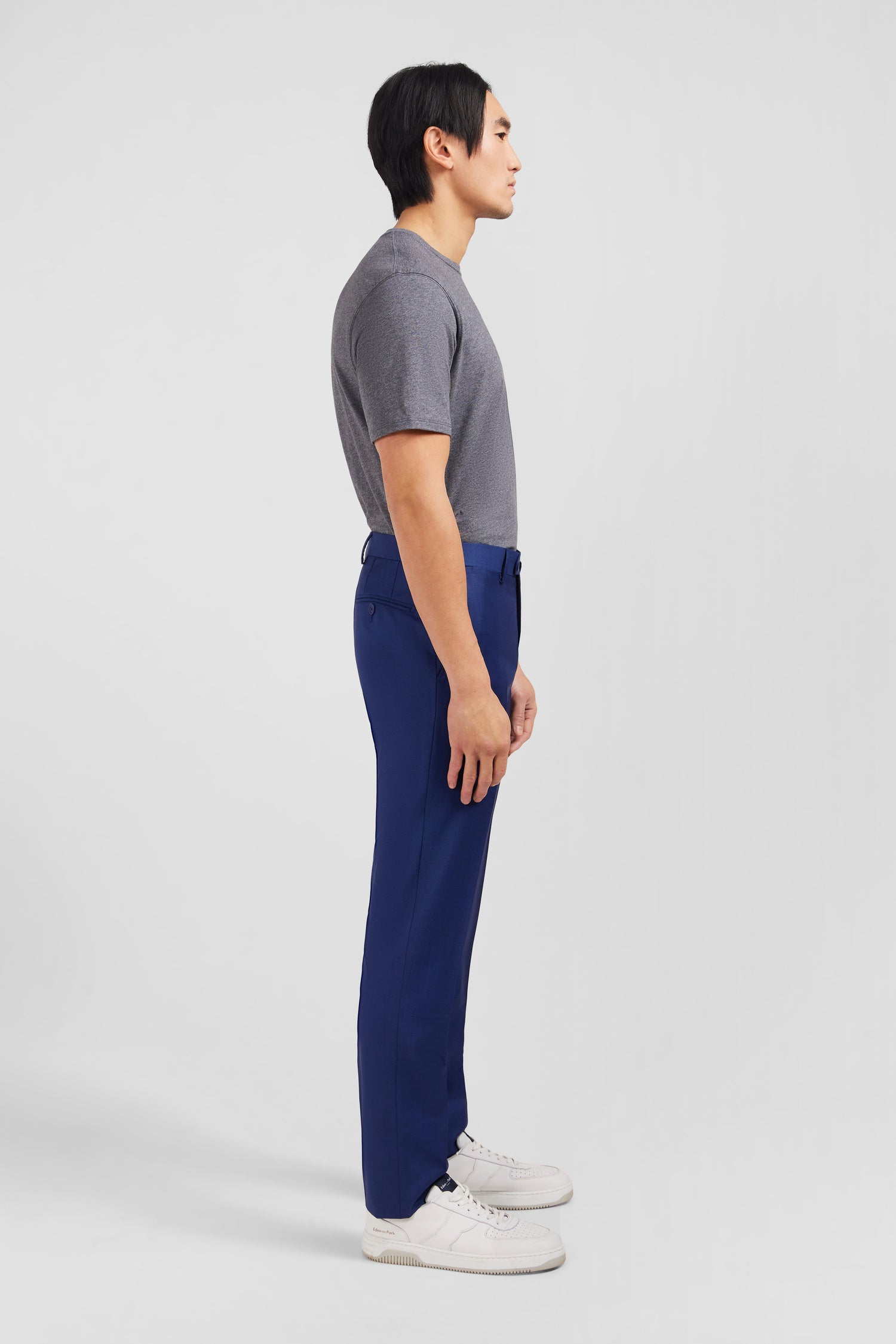 Slim blue wool trousers with broken fold