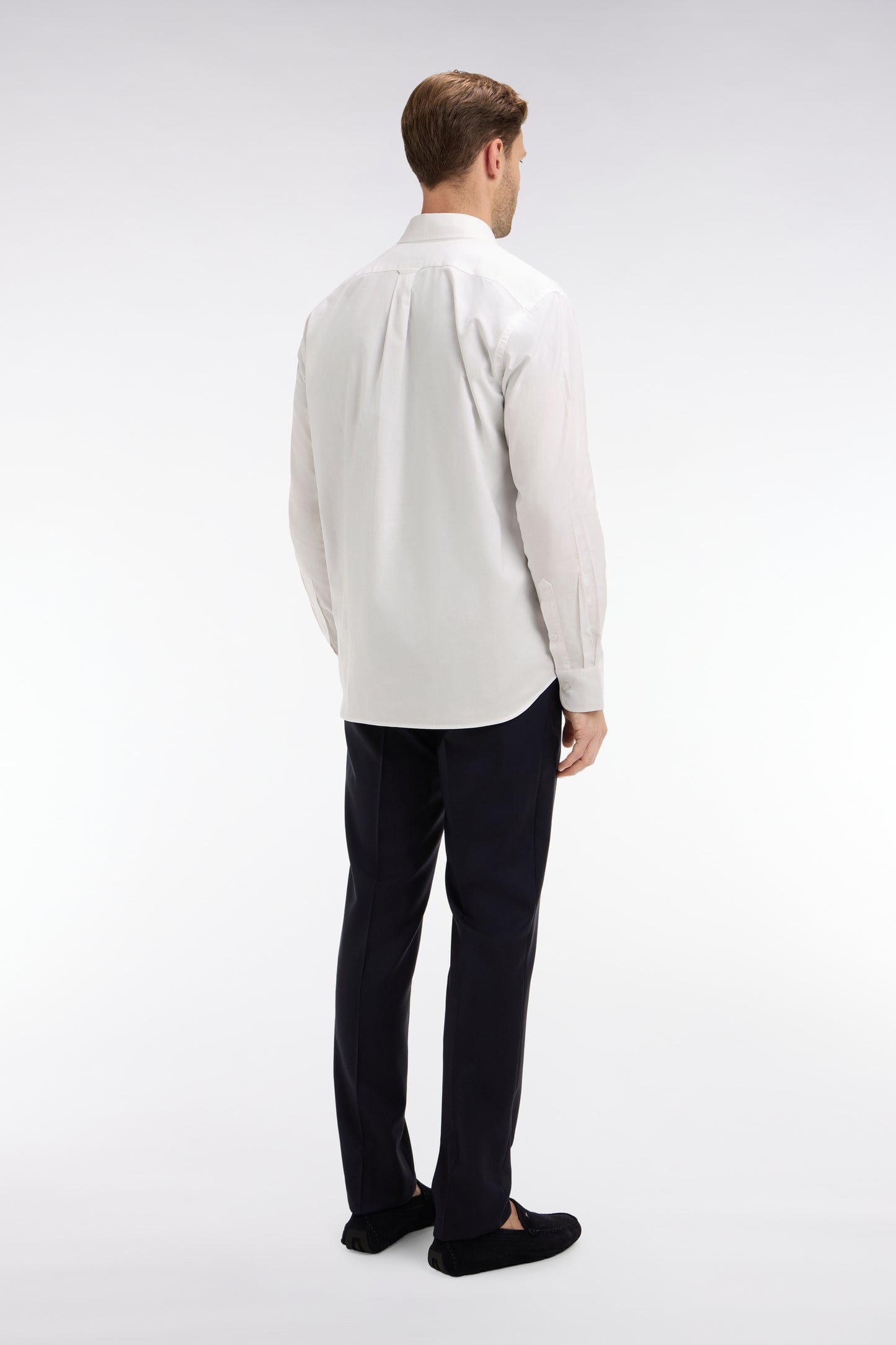 Slim dark blue wool trousers with broken fold