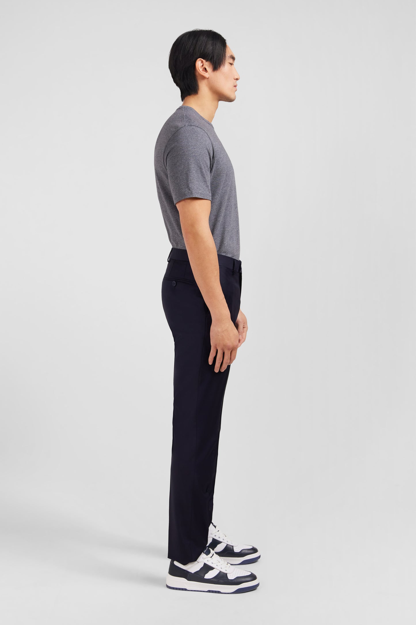 Slim dark blue wool trousers with broken fold