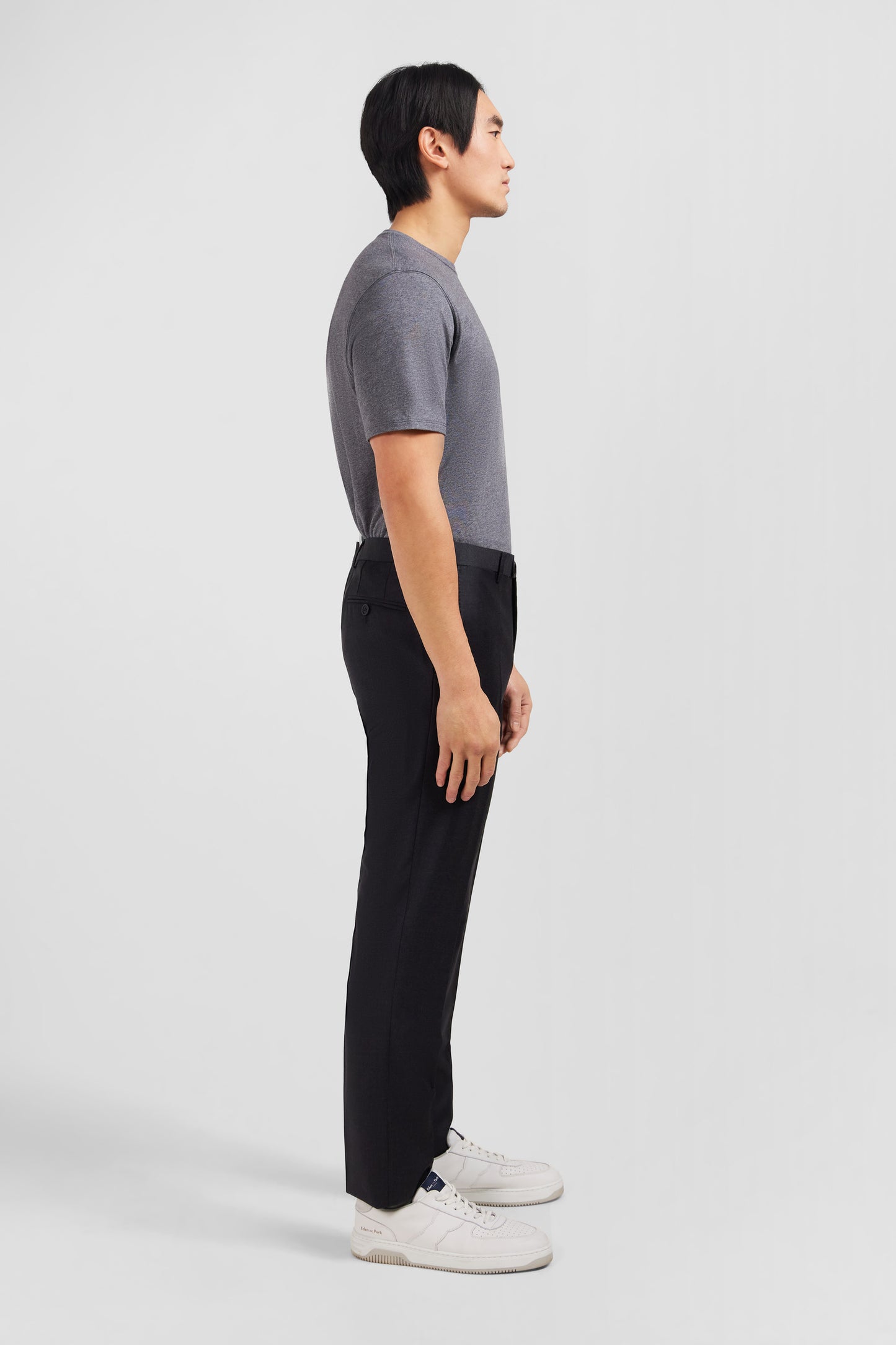 Slim dark grey wool trousers with broken fold