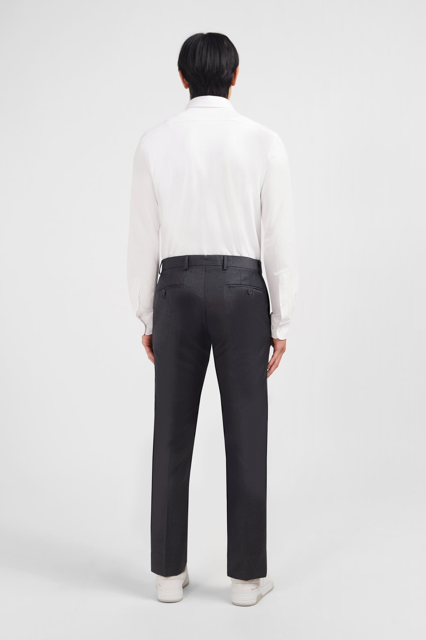 Slim grey wool trousers with broken fold