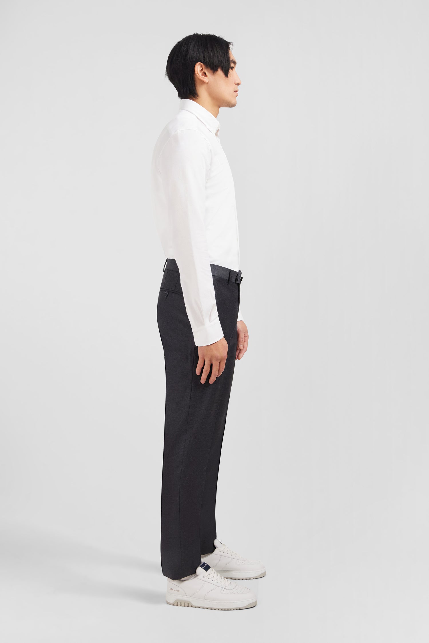 Slim grey wool trousers with broken fold