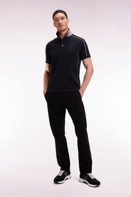 Short-sleeved polo shirt in black cotton piqué with colored piping - Image 3