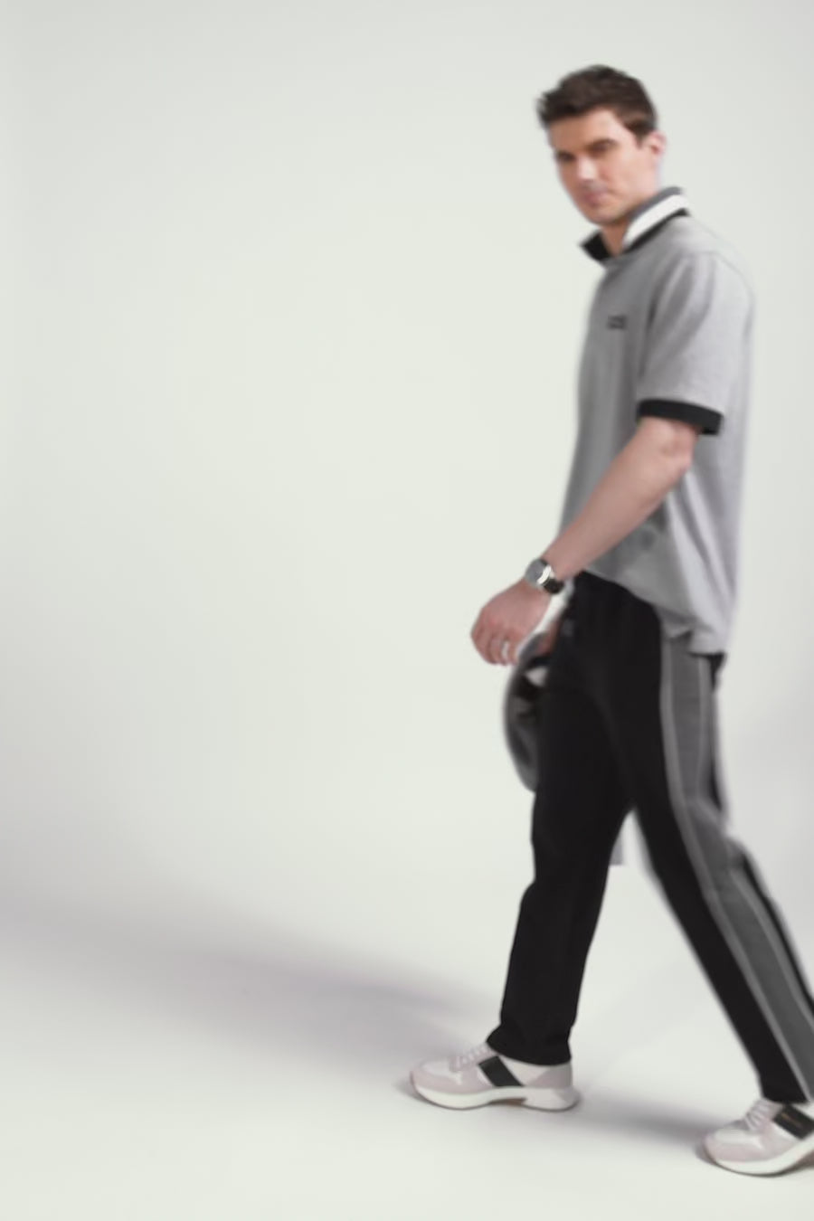 Oversize black short-sleeved cotton piqué polo shirt with tricolor details