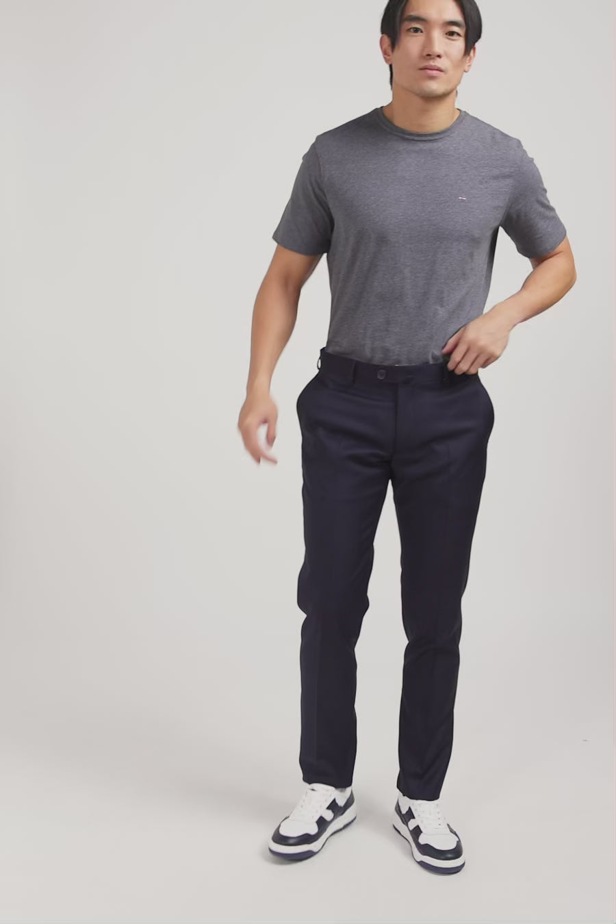 Slim dark blue wool trousers with broken fold