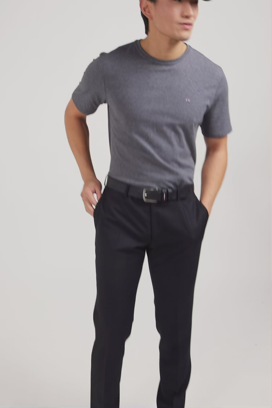 Slim black wool trousers with broken fold