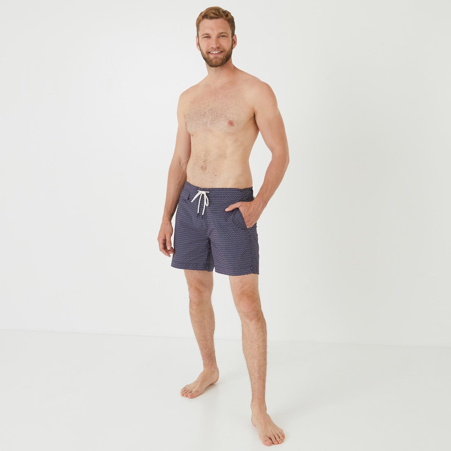 Pink swim shorts with micro motif