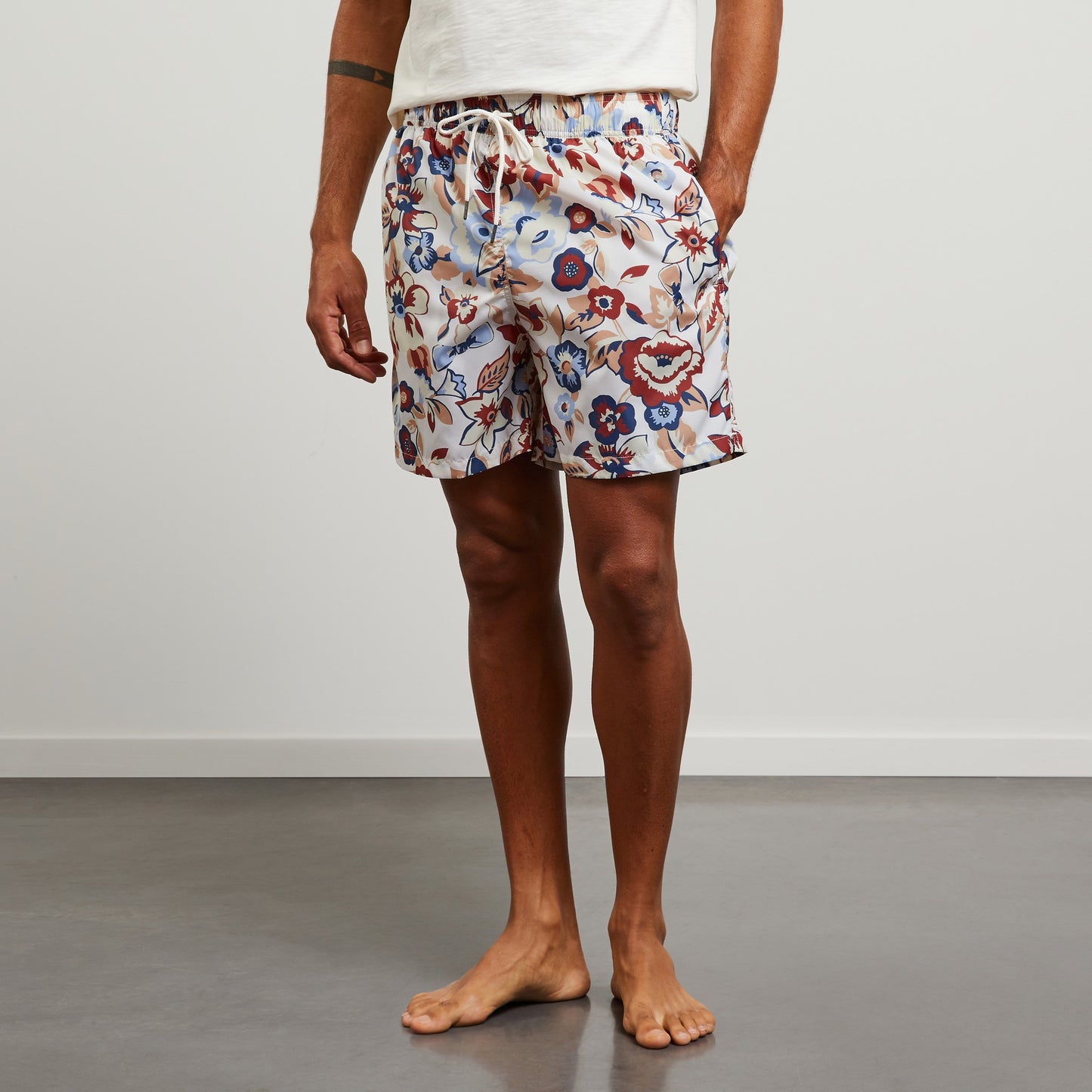 White swim shorts with exclusive floral print
