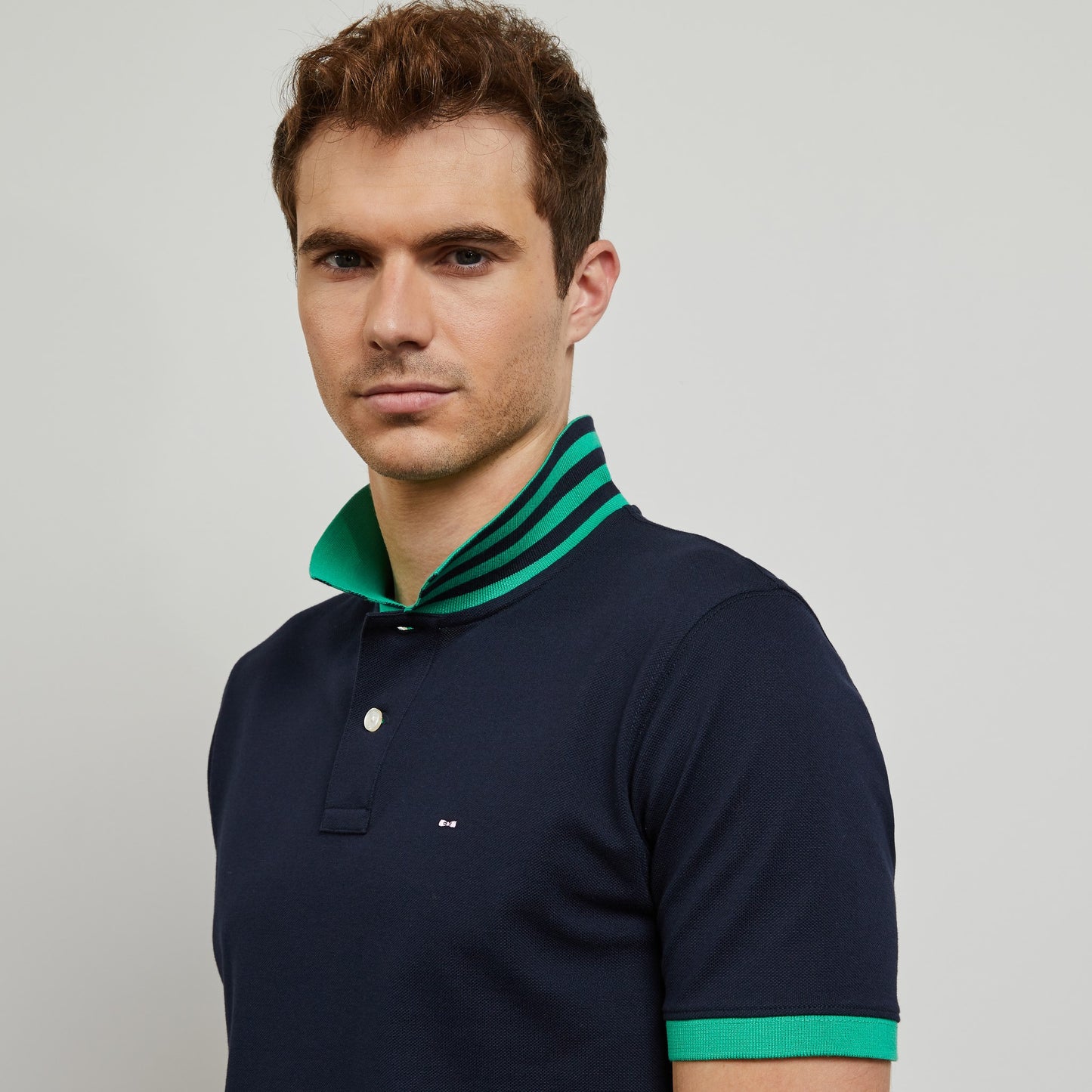 Dark blue polo with green trims, in Pima cotton