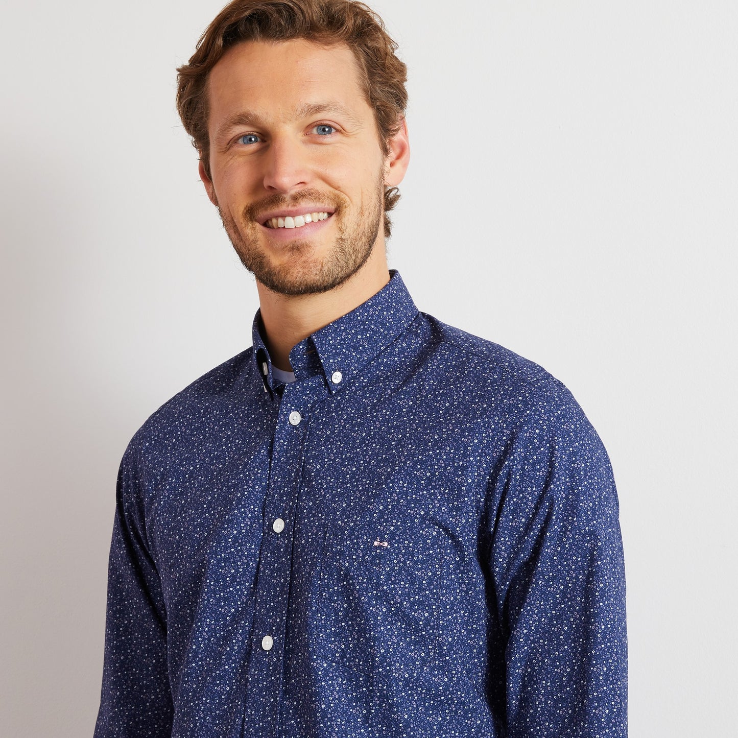 Navy blue shirt with a grey floral motif
